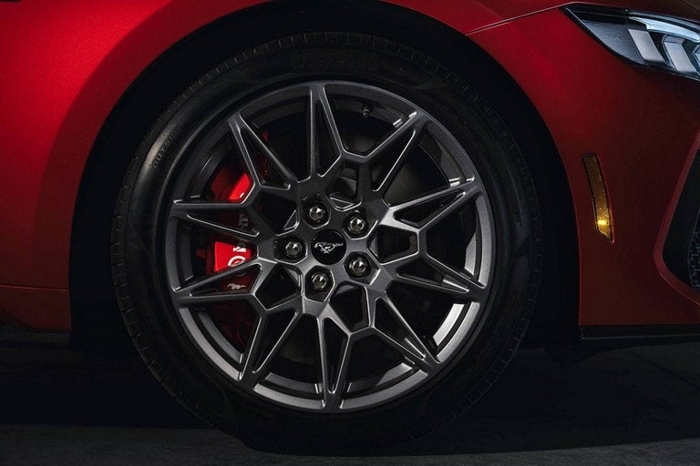 2024 Ford Mustang® model with a close-up of a wheel and brake caliper | Austin Ford in Austin MN