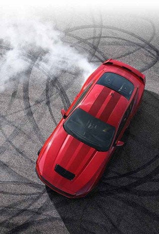 Overhead view of a 2024 Ford Mustang® model with tire tracks on pavement | Austin Ford in Austin MN